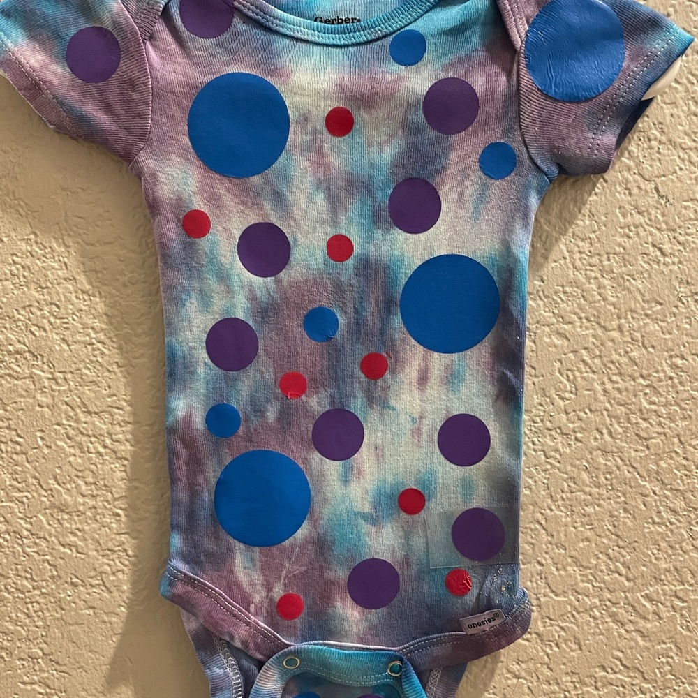 Hand tie dyed baby onesie